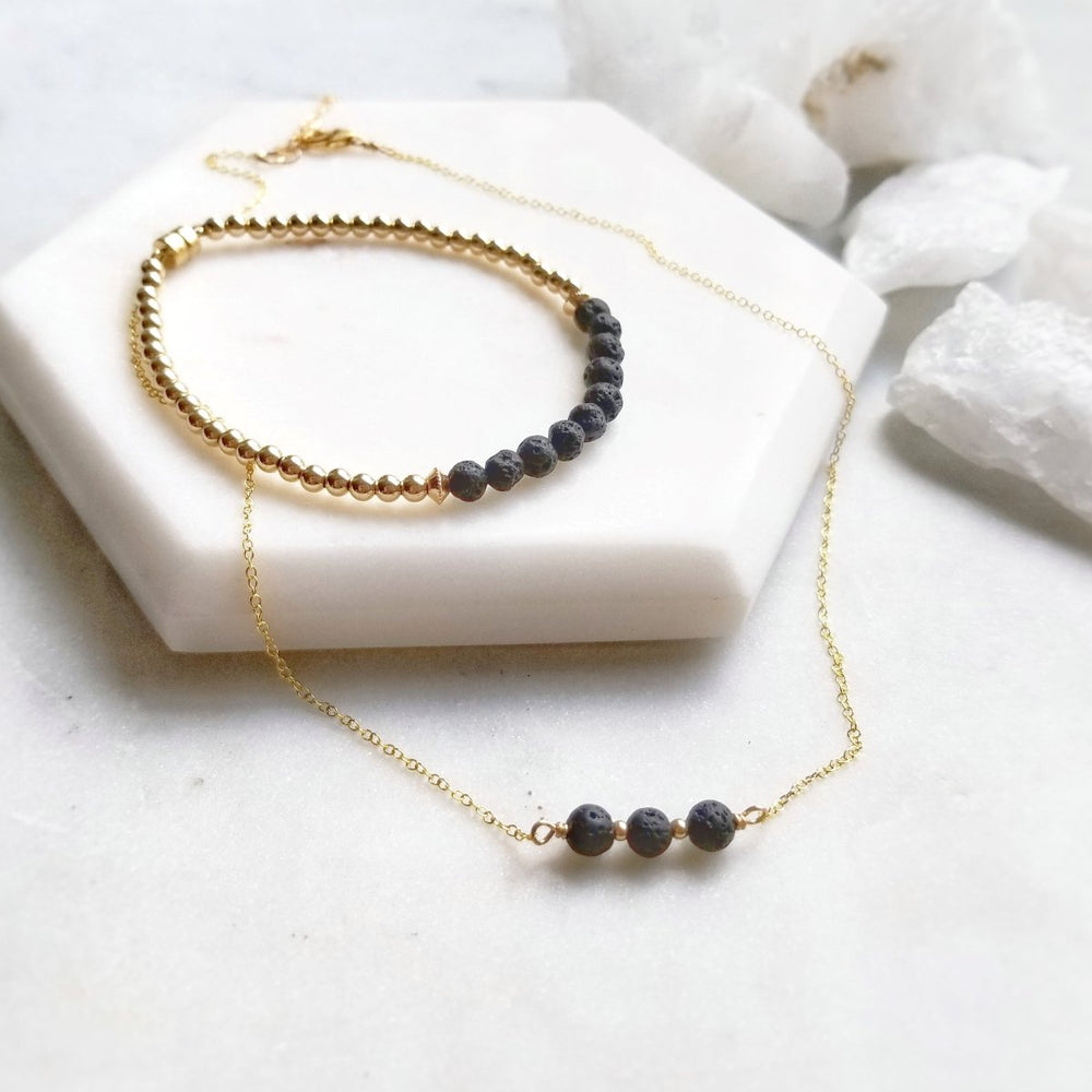 Gold lava stone aromatherapy necklace and bracelet