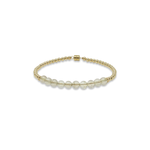 Gold beaded bracelet with rutilated quartz accent beads