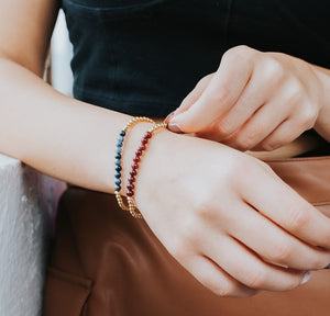 Gold bracelets in blue jasper and garnet