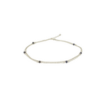 A layered silver anklet with natural sapphire gemstone beads