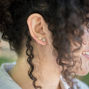 rose quartz studs paired with amazonite studs